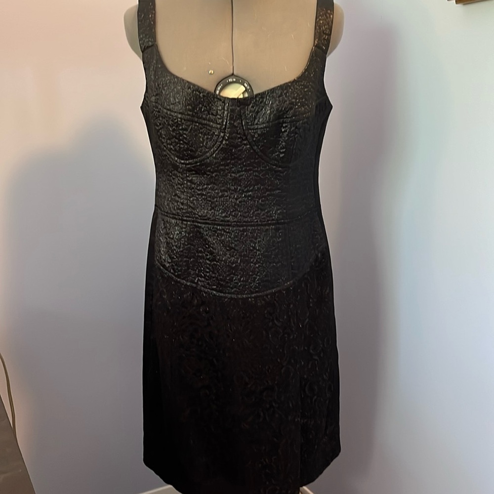 This is a cocktail dress with corset stitching on the bodice